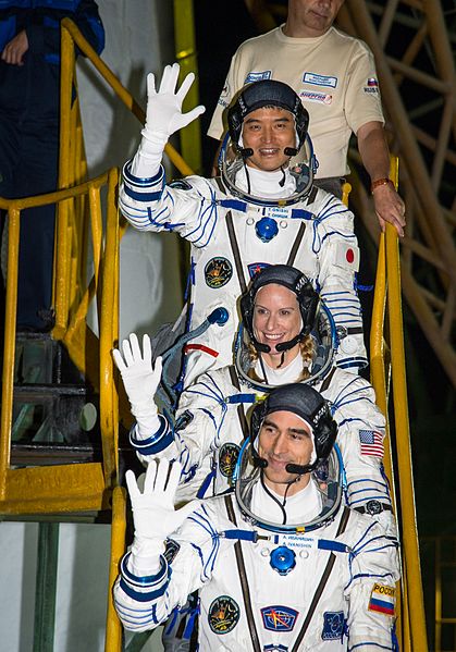 A picture with astronauts waving farewell